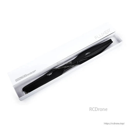 Packaged pair of black FLUXER drone propellers in a clear box with white sleeve