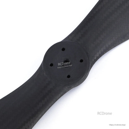 MAD FLUXER VTOL 36.1x14.4 Carbon Fiber Propeller, Close-up of MAD FLUXER VTOL carbon fiber propeller hub with multiple mounting holes and carbon weave finish