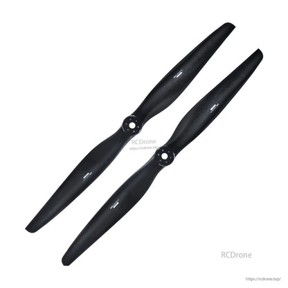 Pair of black carbon fiber paramotor propellers with mounting hubs, one clockwise and one counterclockwise