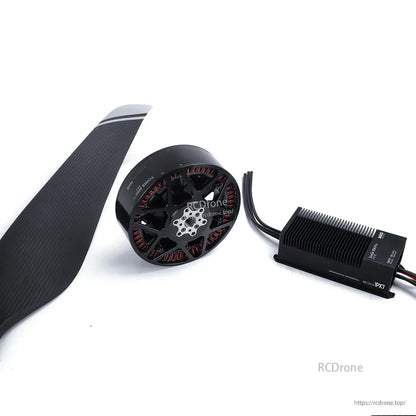 Carbon fiber drone propeller with brushless motor and finned ESC module, wiring leads attached