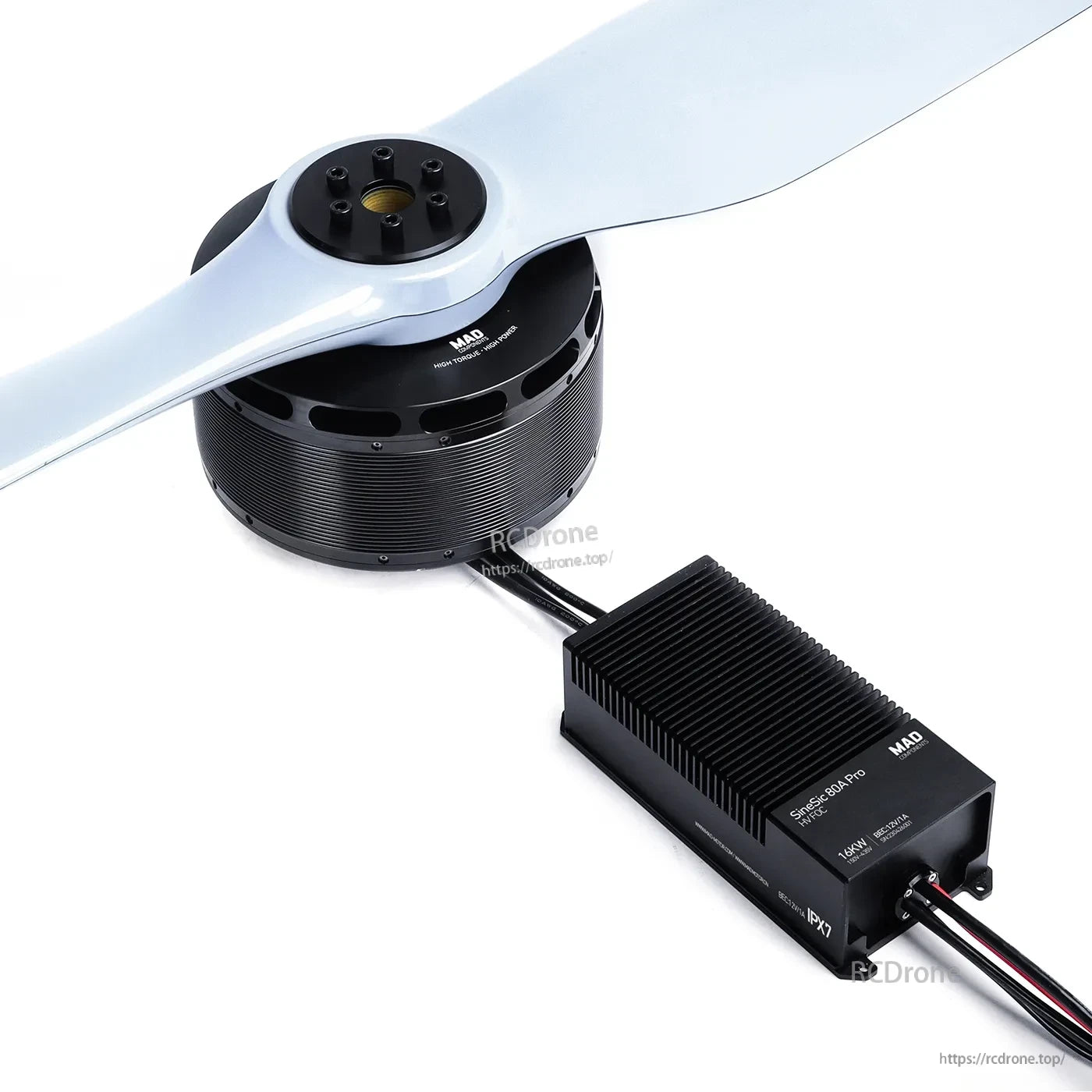 MAD drone power combo with large brushless motor and two-blade propeller connected to finned ESC module