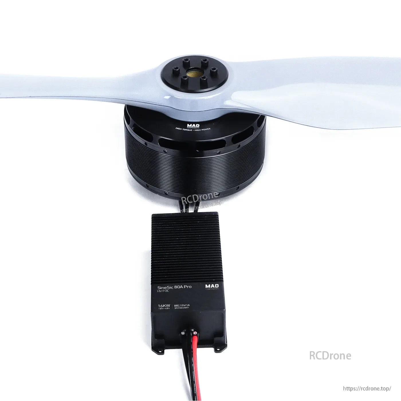 MAD drone motor with large propeller and SineSic 80A Pro ESC with power leads on white background