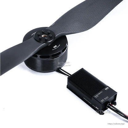 MAD brushless drone motor with 2-blade propeller connected to a finned ESC module via power wires