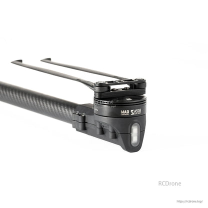 MAD StableCore A508 drone arm with carbon fiber tube, motor mount and folding rotor blades on white background