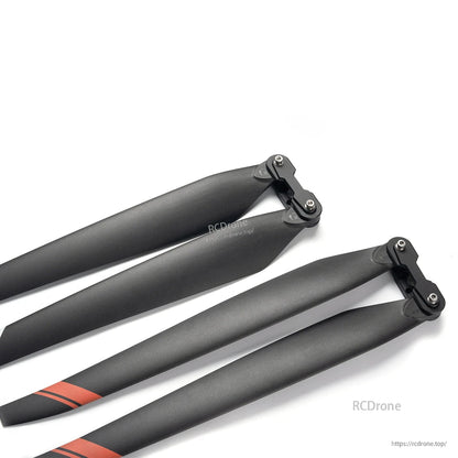MAD TIPUP 43x14in Polymer Folding Propeller, Pair of black folding propeller blades with hinge hubs, 43x14 polymer design, red tip stripes