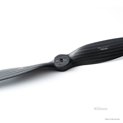 MAD Components Voyager carbon fiber propeller with glossy CF weave finish and central hub for RC aircraft
