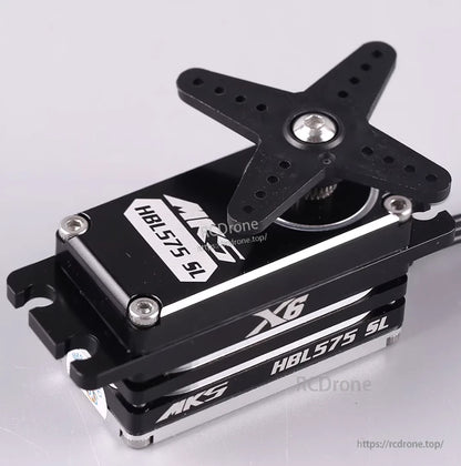 Compact MKS X6 HBL575SL brushless servo with titanium gears, star mount, silver screws, black casing, and white labeling.