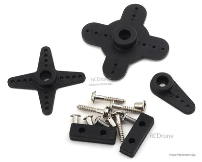 Black servo mounts, screws, and hardware neatly arranged on white for RC drone assembly.