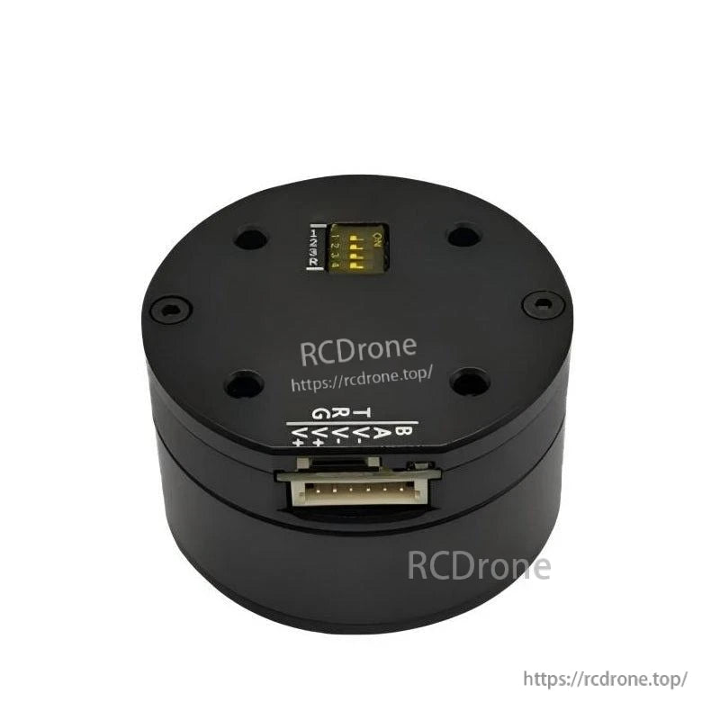 Top view showing DIP address switch and multi-pin control connector on round servo motor housing