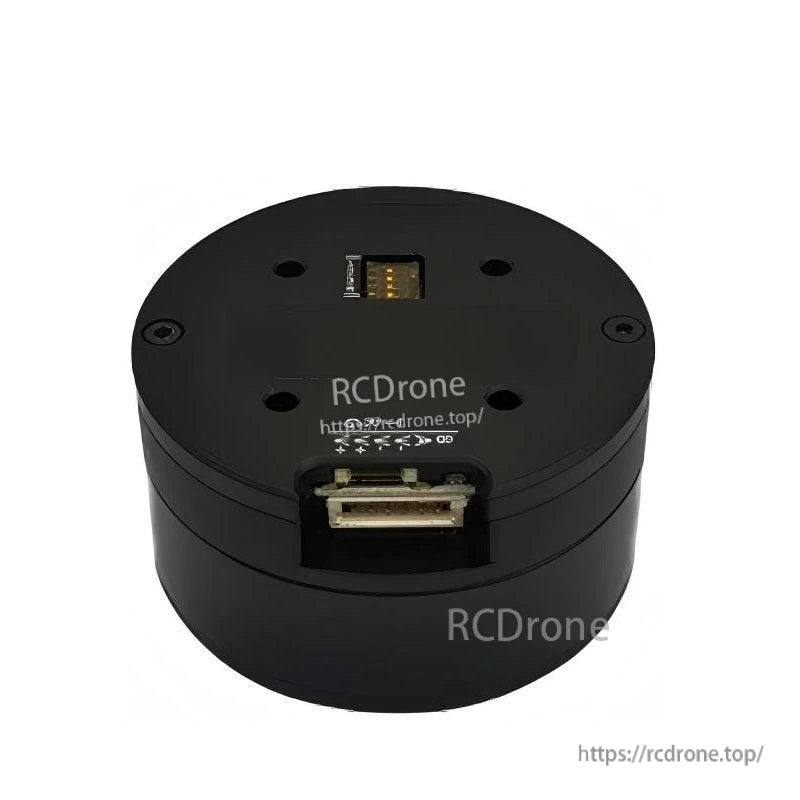 Top-side view of round servo motor housing with recessed connector port and mounting holes
