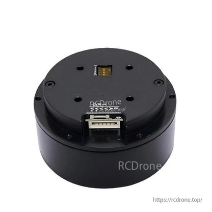 Top view of servo motor housing showing connector sockets and mounting screws (watermarked image)