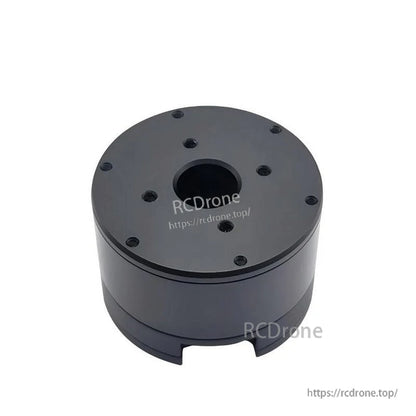 Top view of black cylindrical servo motor housing with center bore and bolt pattern (watermarked)