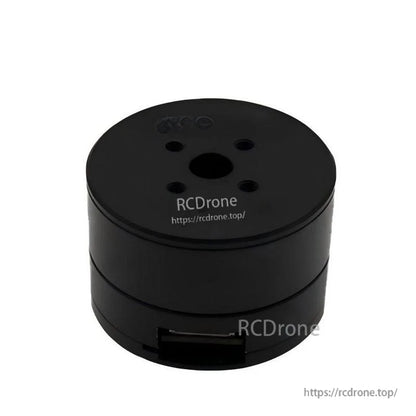 Top view of black cylindrical servo motor with RCDRone watermark, showing mounting holes and side connector opening