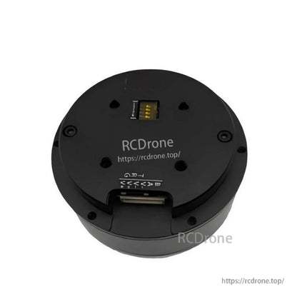 Rear housing close-up with top pin header and bottom connector slot, shown with RCDRone URL marking
