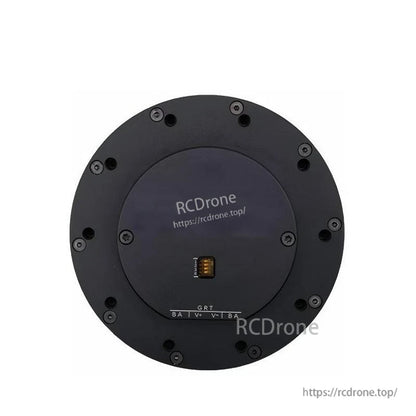 Back face of circular geared servo drive showing central multi-pin connector and mounting screw pattern