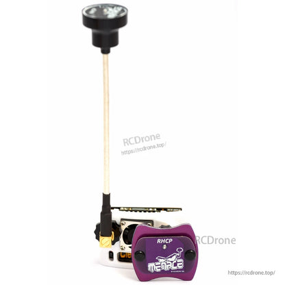 Front view of purple Menace RHCP patch antenna attached to FPV goggle module with long antenna upright