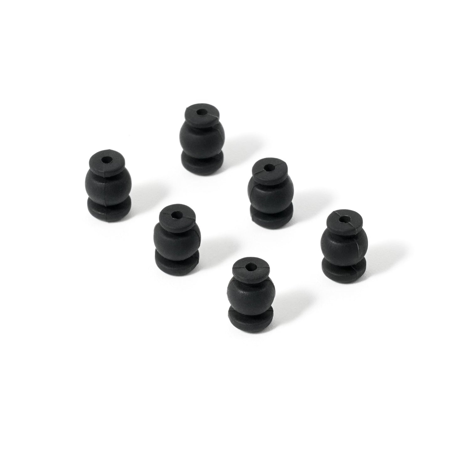 Vibration damping rubber balls, angled view showing shape and center hole for mounting