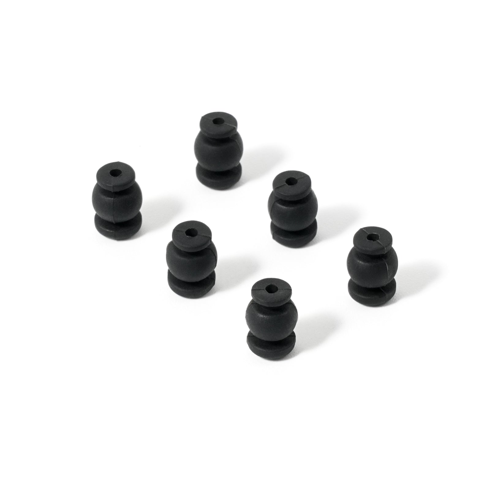Vibration damping rubber balls, angled view showing shape and center hole for mounting