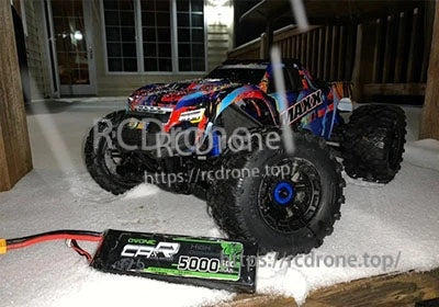 OVONIC 3S 5000mAh LiPo battery beside a large RC monster truck for scale and fit reference