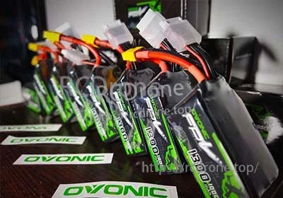 Multiple Ovonic FPV LiPo packs with XT60 leads and balance connectors lined up for charging and storage