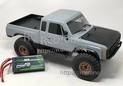 OVONIC 2S 7.4V 5000mAh 50C hardcase LiPo battery beside a 1/10 RC truck, Deans plug visible