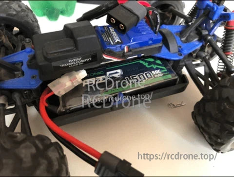 OVONIC 1500mAh 2S 7.4V 50C LiPo battery installed in an RC car with Deans T plug wiring