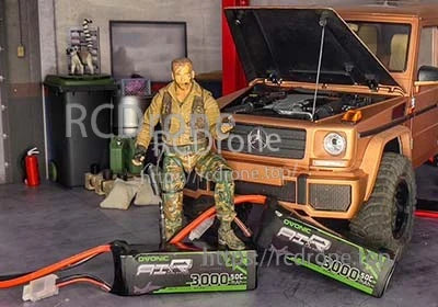 OVONIC 3S 11.1V 3000mAh 50C LiPo battery packs with Deans plug next to an RC truck for scale