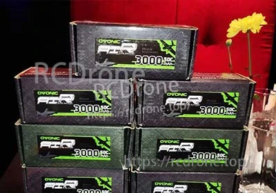 Stack of OVONIC 3000mAh 50C battery retail boxes showing branding and capacity on the front