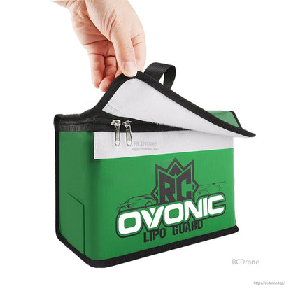 Close-up of the bag’s lifted Velcro flap, white inner lining, and dual zipper closure