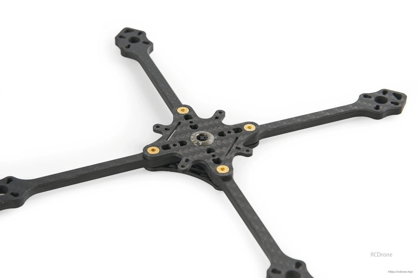 Low-angle view of carbon fiber toothpick frame base showing motor mount ends and center plate cutouts