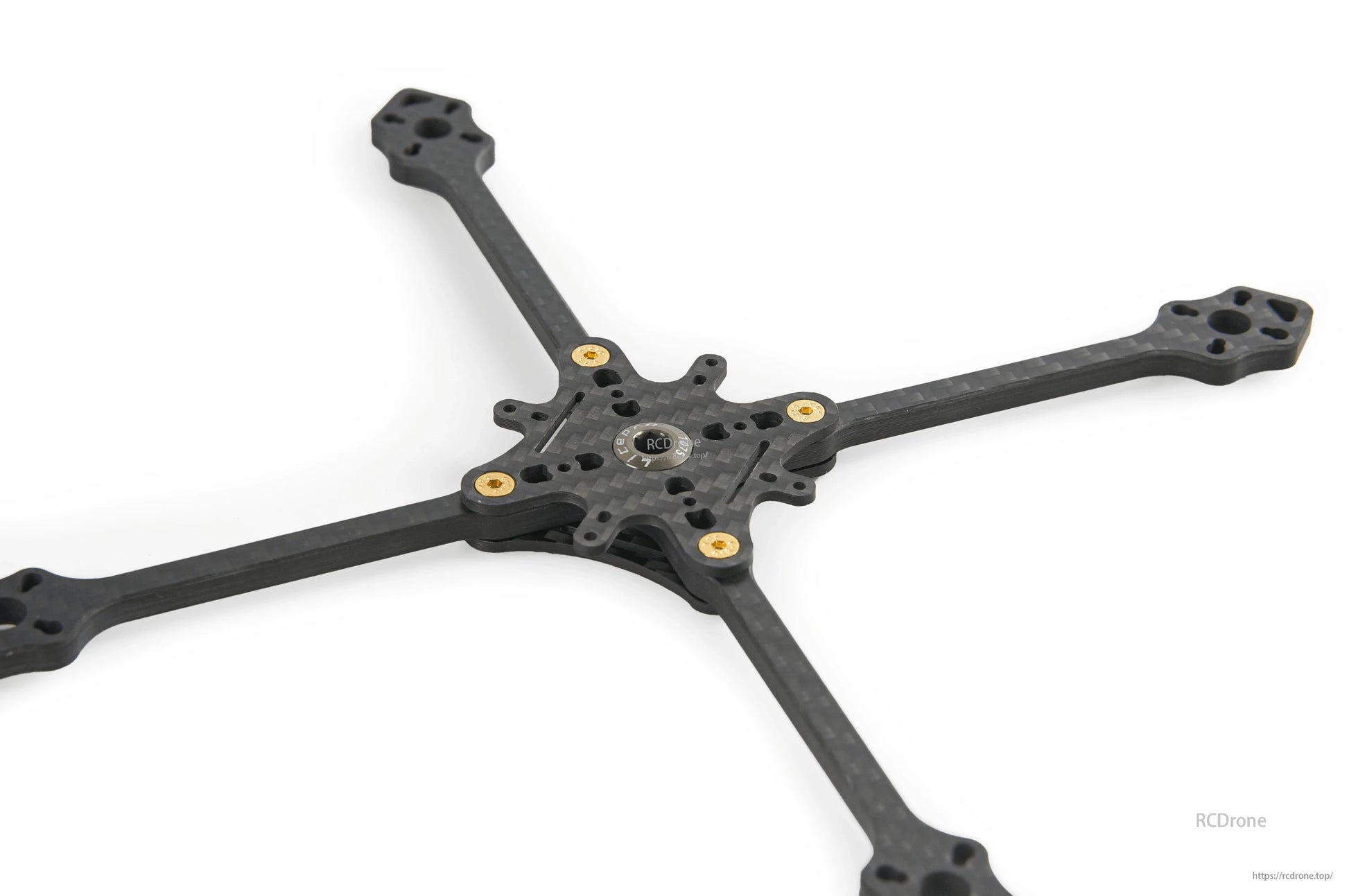 Low-angle view of carbon fiber toothpick frame base showing motor mount ends and center plate cutouts