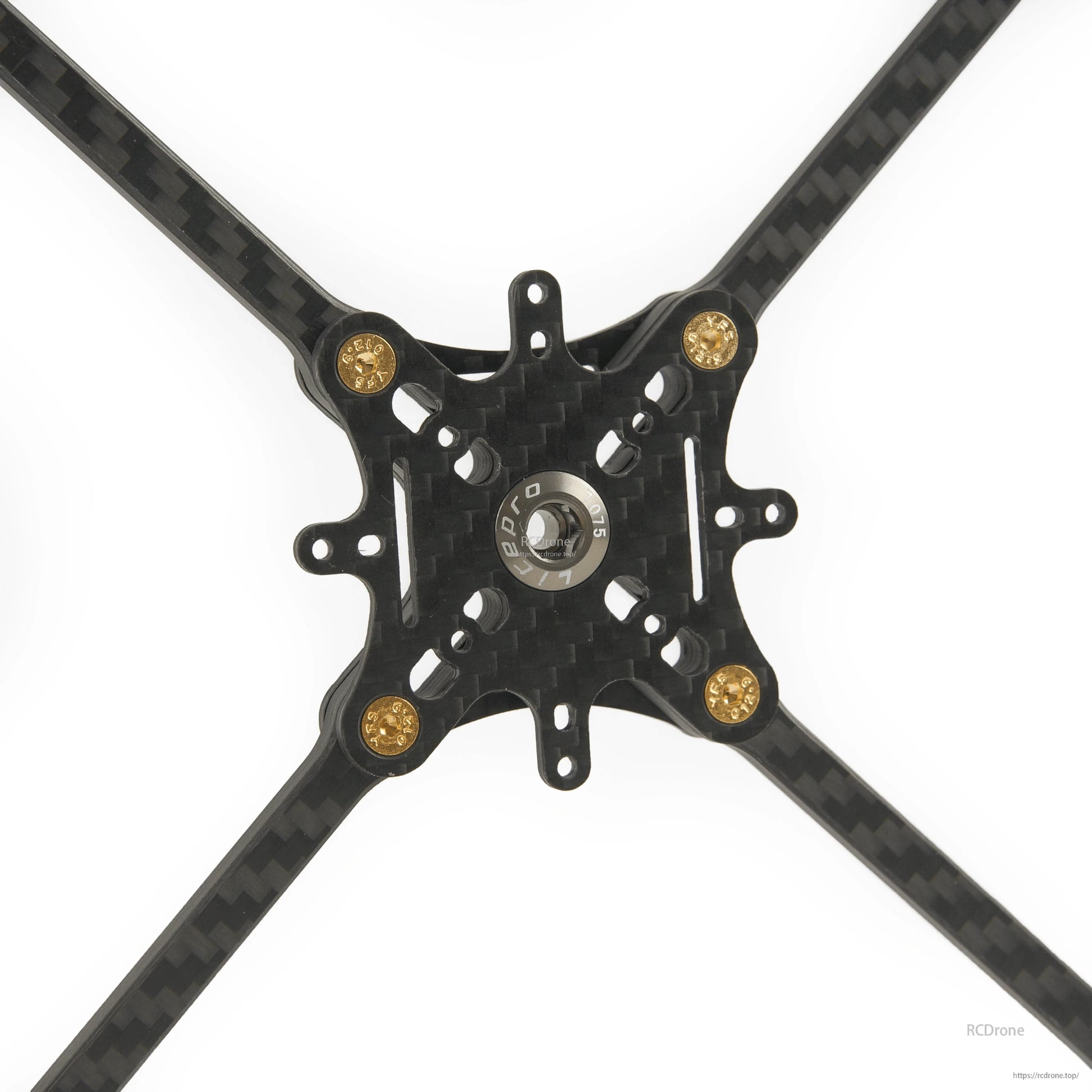 Close-up of carbon fiber center plate with mounting holes and gold standoffs on toothpick frame