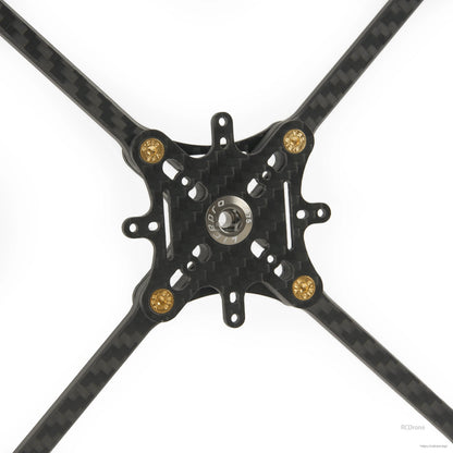Close-up of carbon fiber center plate with mounting holes and gold standoffs on toothpick frame