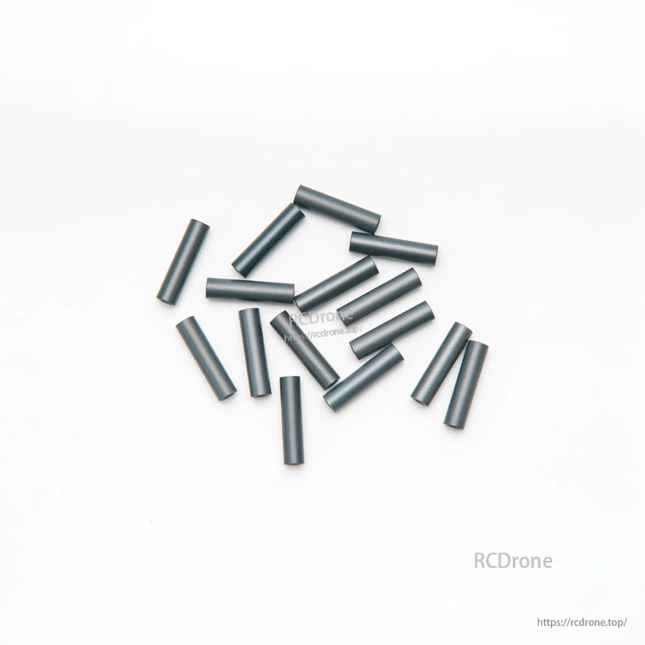 Unbranded black aluminum spacer tubes laid out on white background, multiple lengths