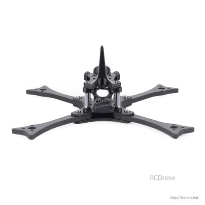 Front view of carbon FPV racing frame showing nose profile, center stack area, and four arms