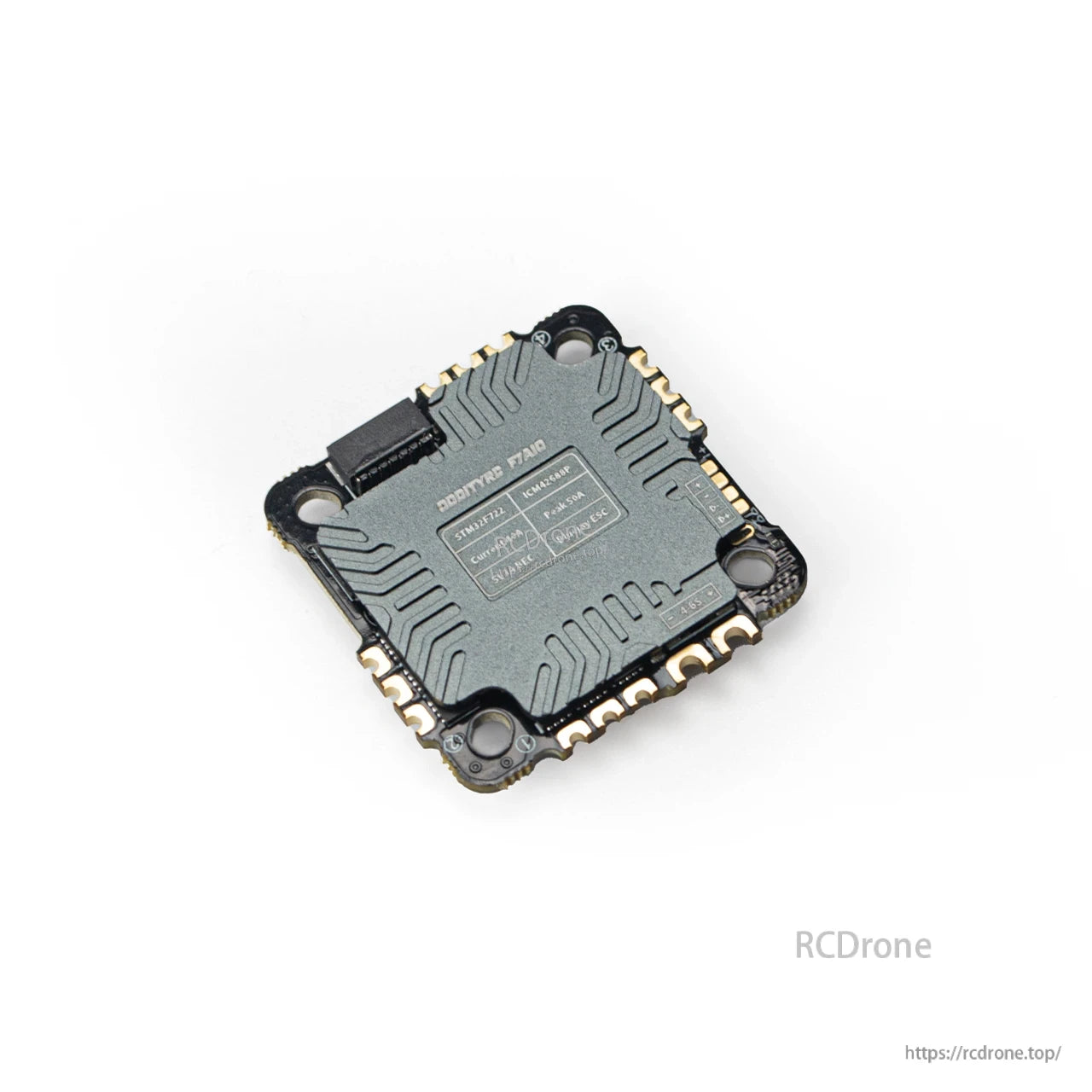 Angled rear view showing printed specification label and corner mounting holes on the AIO board