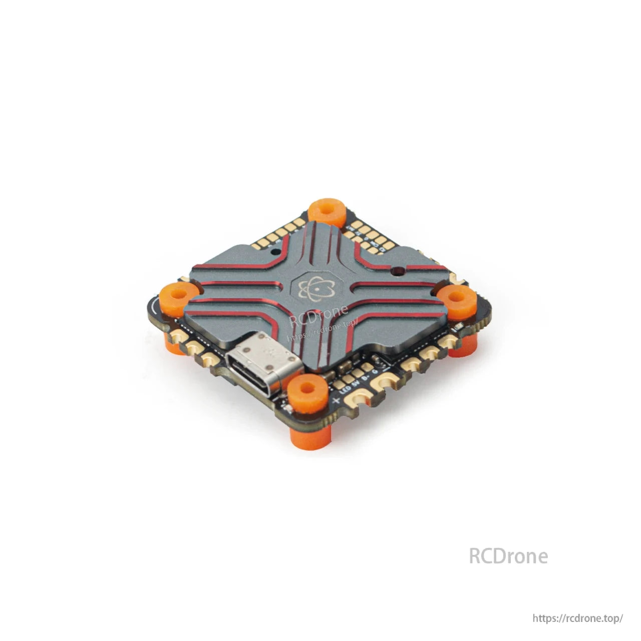 AIO flight controller installed with orange soft mounting grommets, angled top view