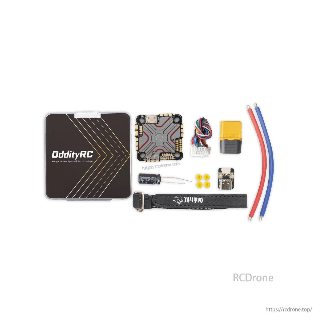 Package contents laid out: OddityRC case, AIO board, wires, strap, capacitor, grommets and small adapter