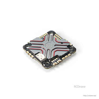 Angled top view of the AIO flight controller heatsink cover with USB-C connector and solder pads