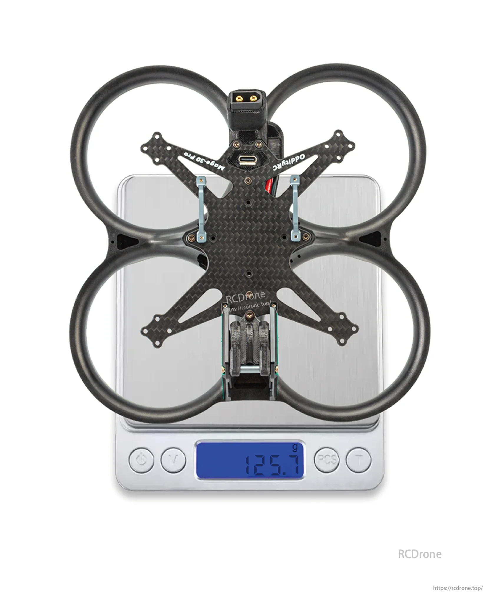 Mage-Pro ducted frame on digital scale showing 125.7g displayed weight