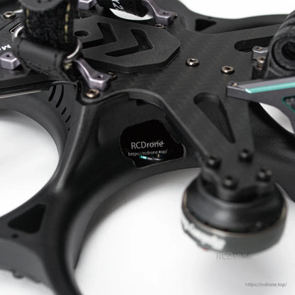 Close-up of frame side cutout and carbon fiber top plate with screws and mounting hardware