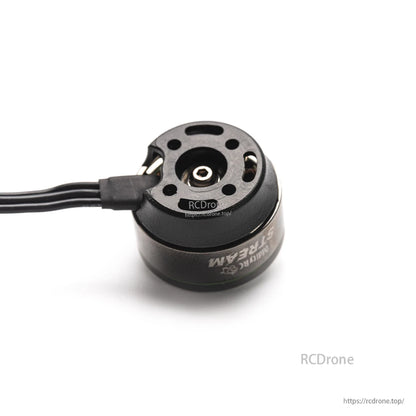 Installed motor cover with motor wires attached, top view of mounting holes and center hub