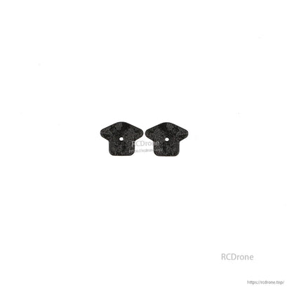 Two small carbon fiber tabs/brackets with single center mounting hole