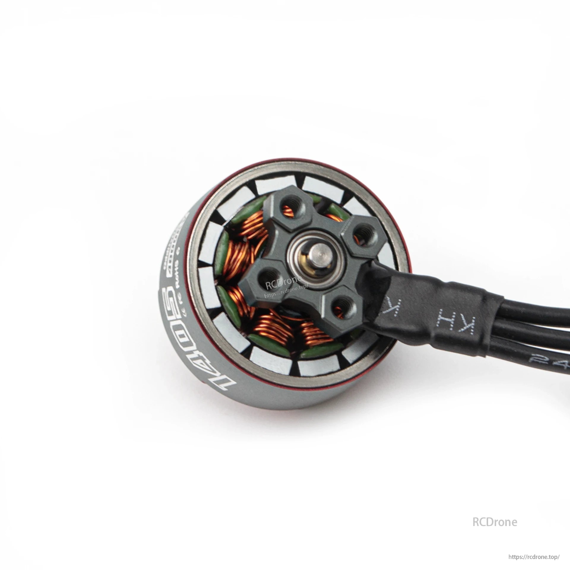 Bottom view of motor base showing mounting plate, bearing center, and exposed stator windings