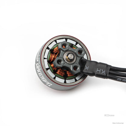 Bottom view of motor base showing mounting plate, bearing center, and exposed stator windings