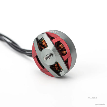 Angled side view of OddityRC Spinnybois 2004 2650KV motor showing shaft and open-frame windings