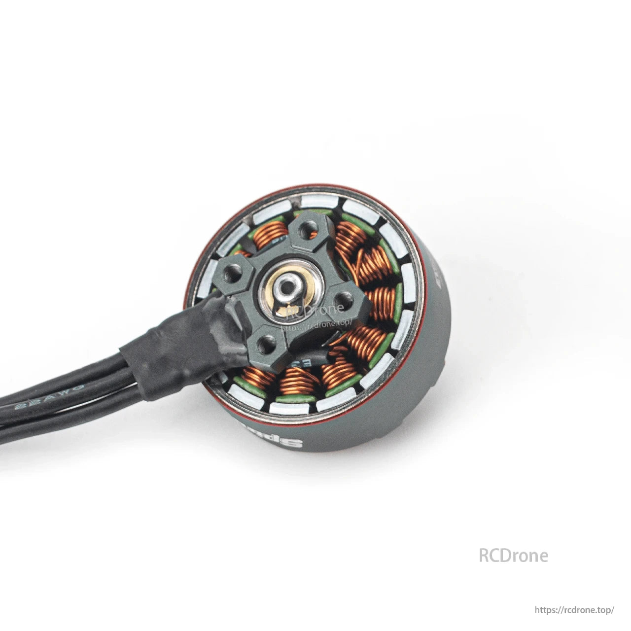Bottom view showing mounting base and stator windings with attached motor wires