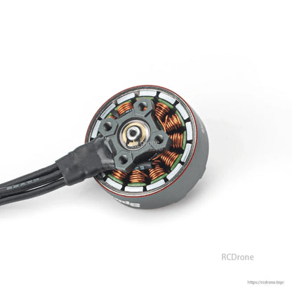 Bottom view showing mounting base and stator windings with attached motor wires