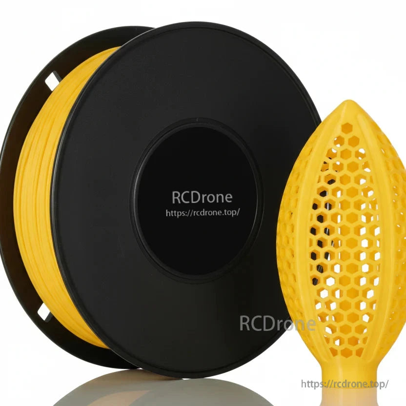 Yellow filament spool close-up with honeycomb lattice football-shaped sample