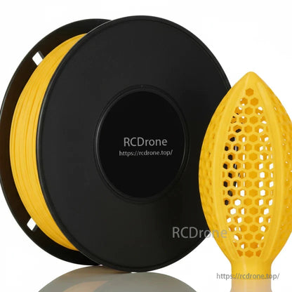 Yellow filament spool close-up with honeycomb lattice football-shaped sample